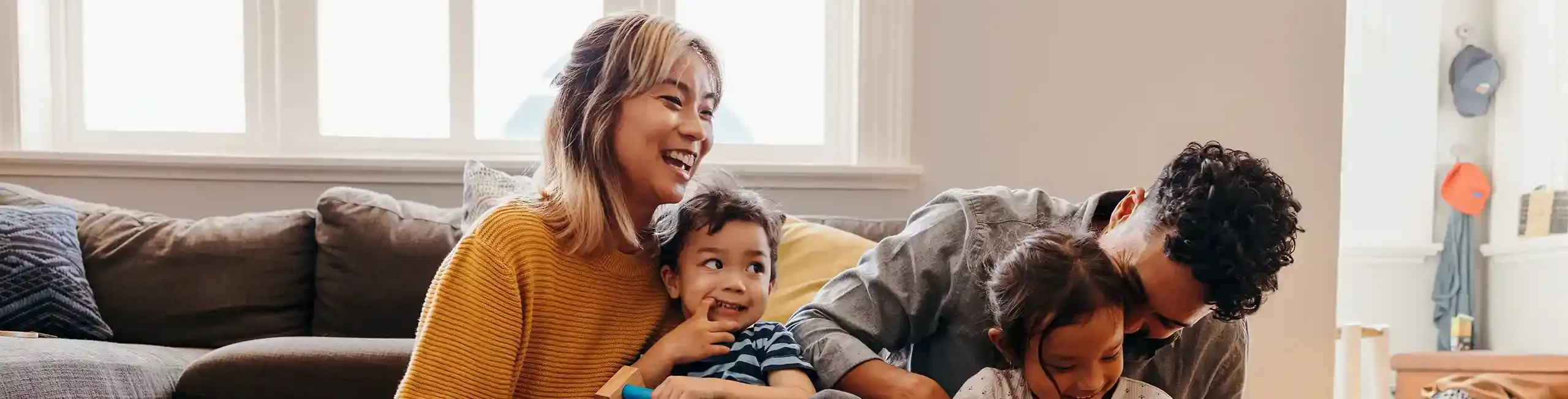 Happy family on couch in home