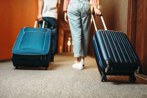 Hard-case suitcases in a hotel to prevent bed bug infestations in Atlanta GA - Active Pest Control