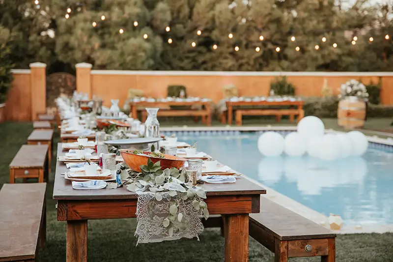 Suburban backyard with a pool and outdoor furniture