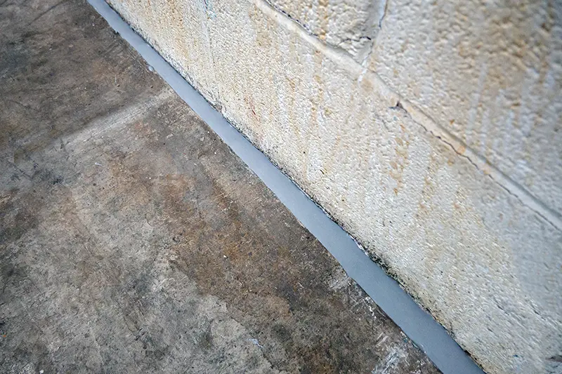 Filled crack space in-between the bricks of a wall & concrete flooring, perfect for Active Pest Controls Flexi Armour protection.